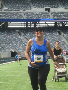 Esther finishing her last 5K race at Met Life Stadium in July.